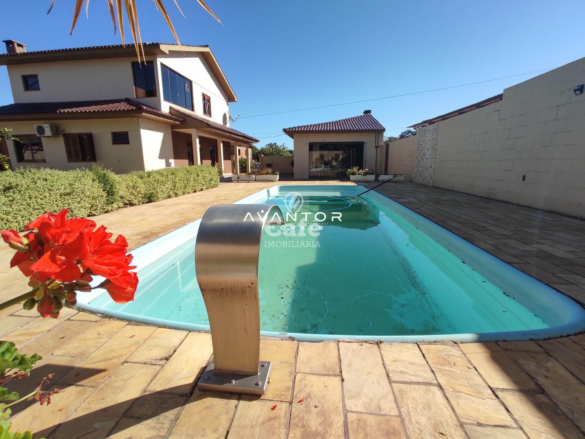 Linda Casa com 3 dormitórios, sendo 2 suítes, amplo pátio, piscina e salão de festas — Casa com 3 quartos à venda em Urlândia, Santa Maria/RS